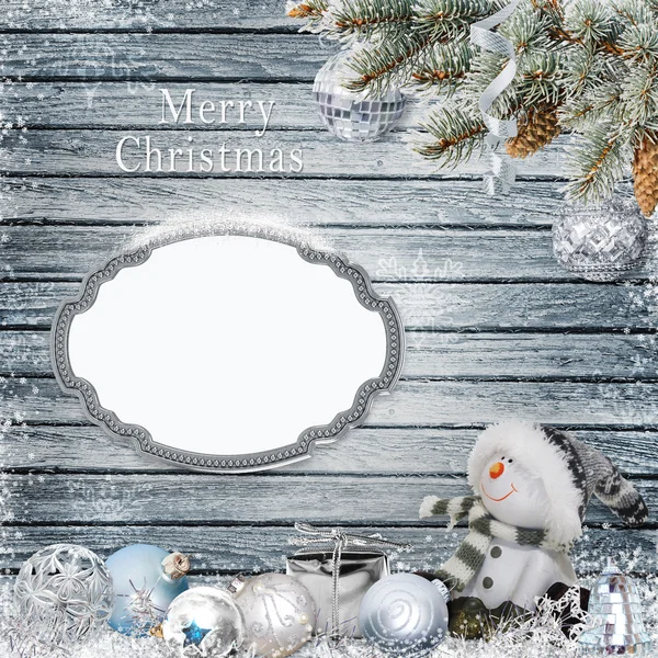 Christmas congratulatory background with frame for text or photo, snowman, pine branches and Christmas decorations — Stock Photo, Image