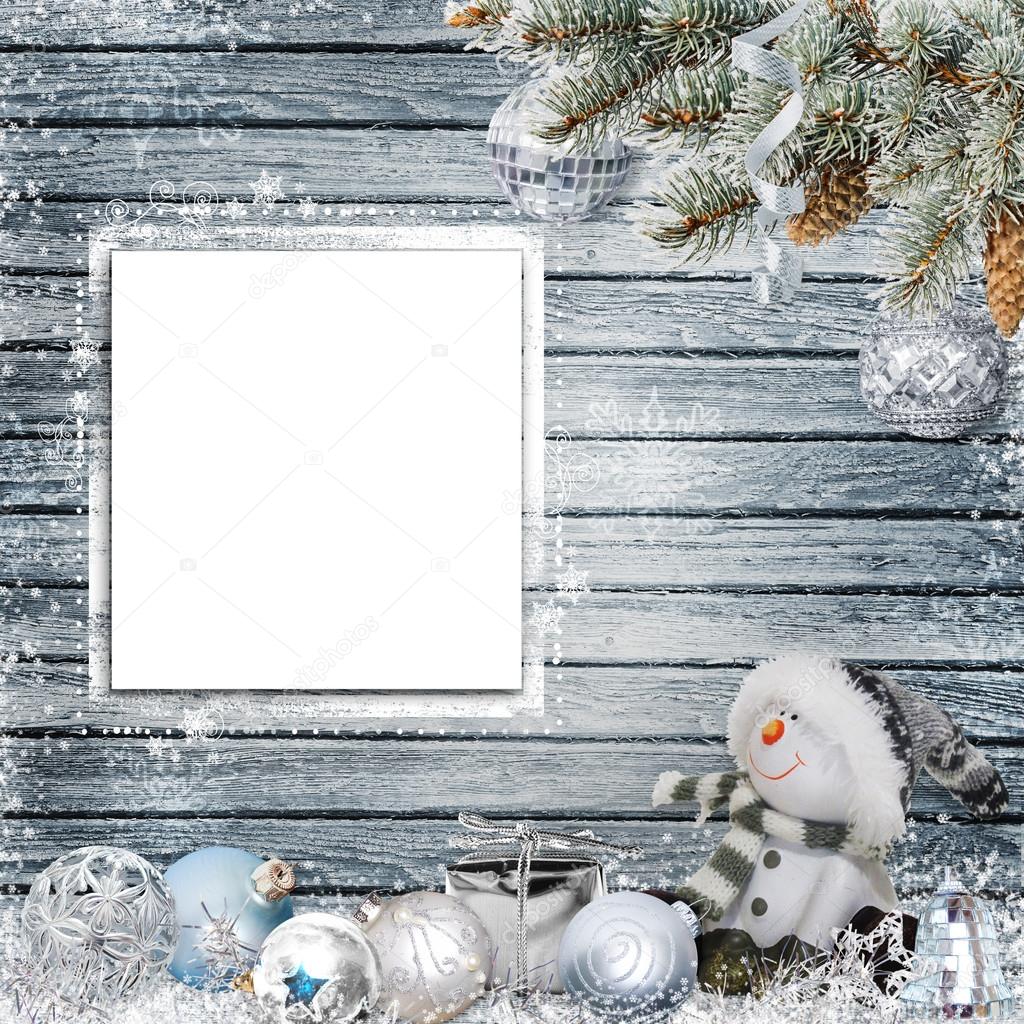 Christmas congratulatory background with frame for text or photo, snowman, pine branches and Christmas decorations
