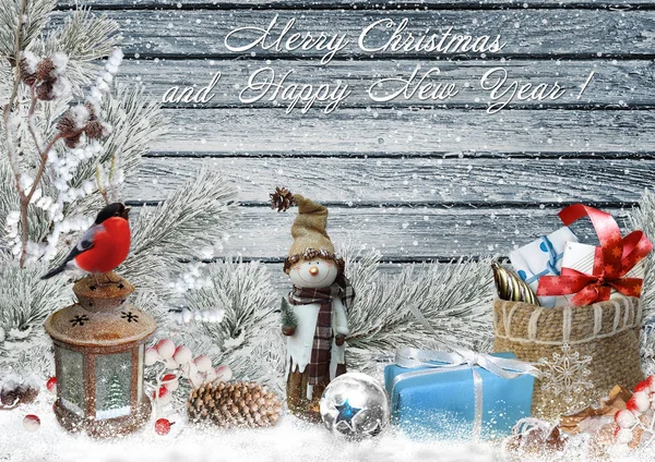 Christmas greeting card with pine branches, snowman, gifts and Christmas decorations — Stock Photo, Image