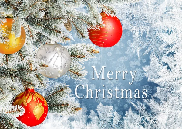 Christmas greeting card with pine branches and balls on the frosty patterns background — Stock Photo, Image