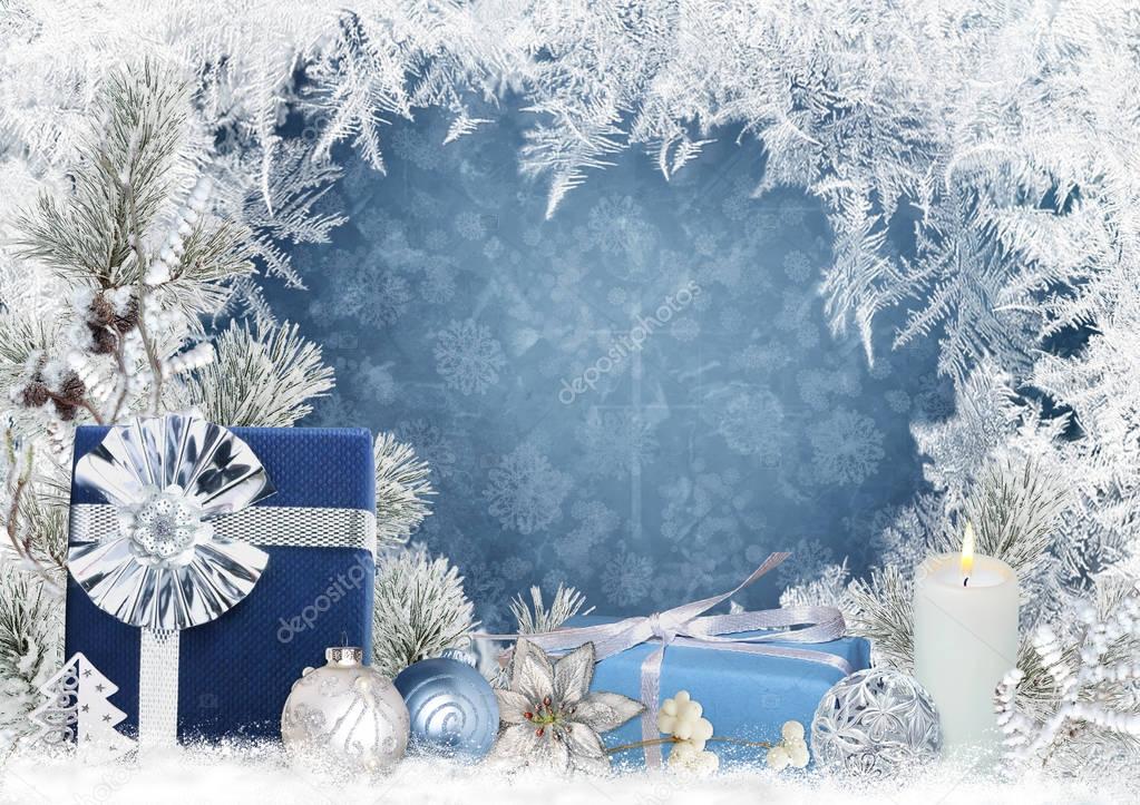 Christmas greeting card with gifts, candle, pine branches, balls on a blue background with a frosty pattern