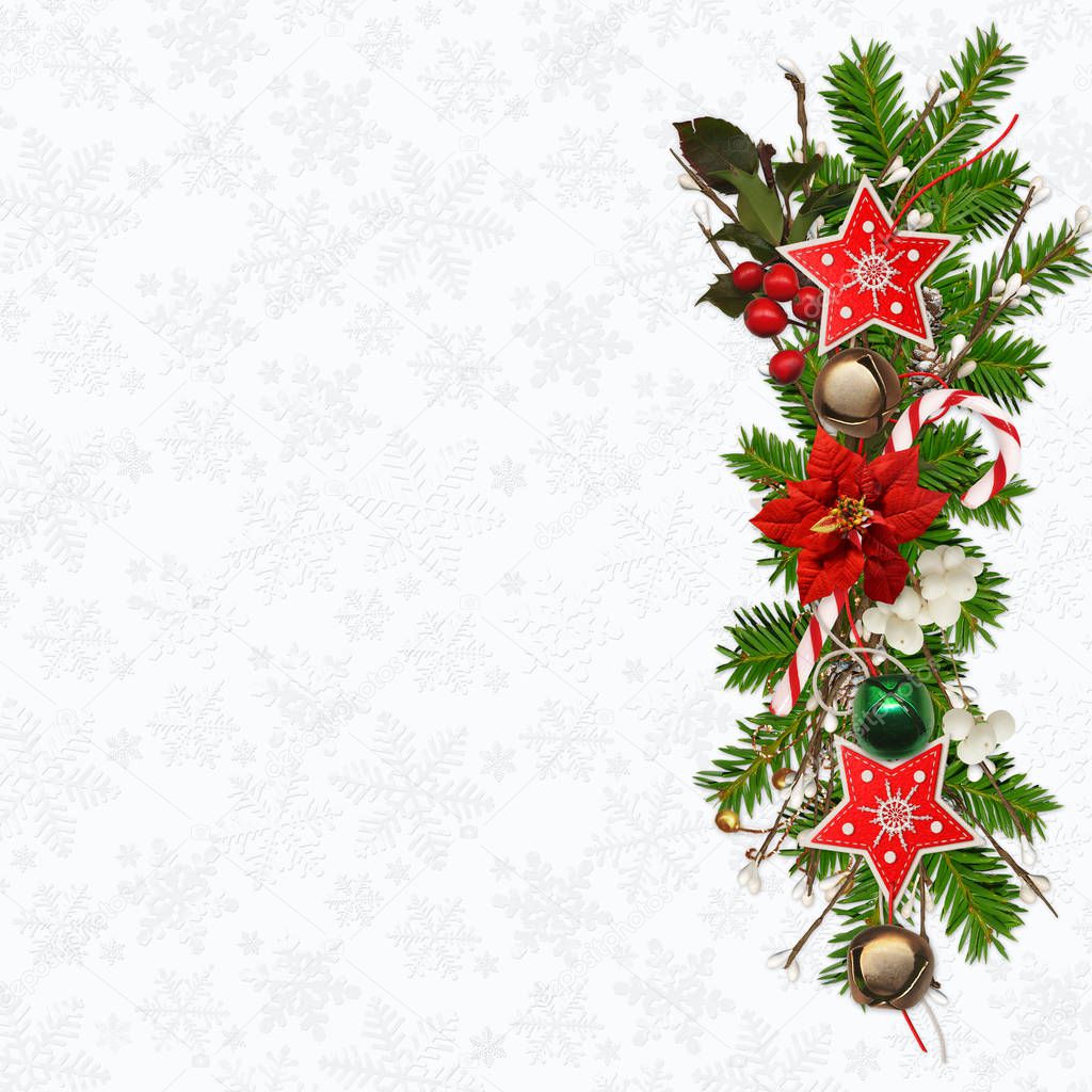Christmas greeting background with space for text, with pine branches, christmas bells, garland of stars, berries and poinsettia