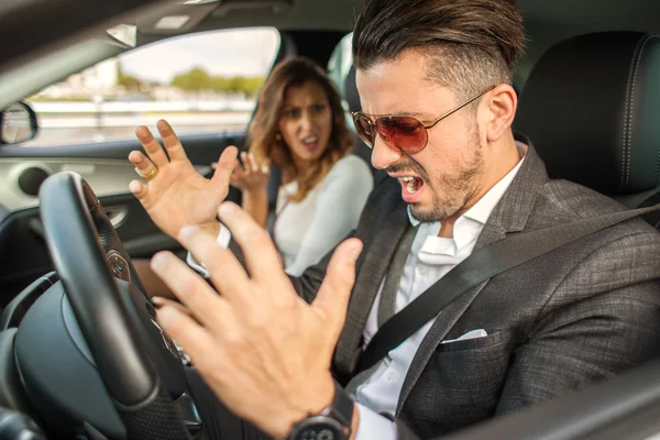 Beautiful couple fighting in car — Stock Photo, Image