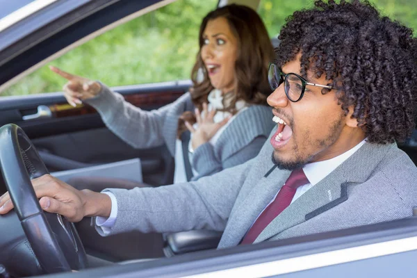 Angry driver honking in traffic while girl is yelling