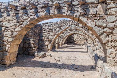 Ruins of vaults at Qasr al-Azraq (Blue Fortress), fort located in the desert of eastern Jordan. clipart