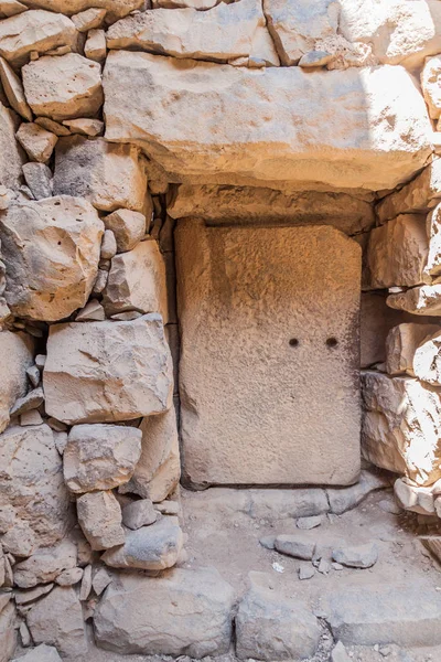 Stone door at Qasr al-Azraq (Blue Fortress), fort located in the desert of eastern Jordan.