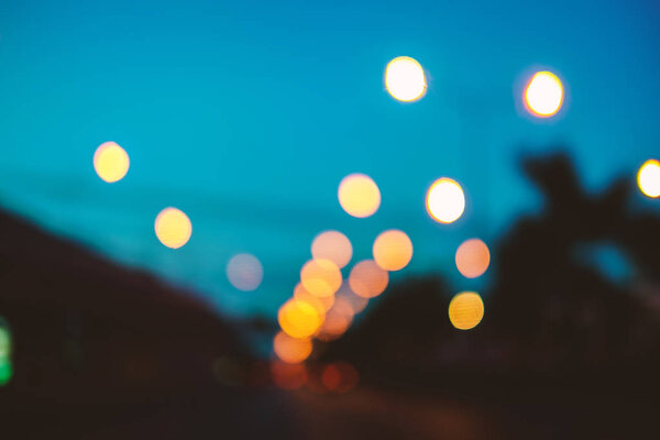 Abstract background, bokeh light on the traffic road at night