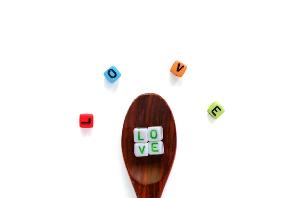 Love Word Alphabet Letter Bead Wooden Spoon Spreading Out White — Stock Photo, Image