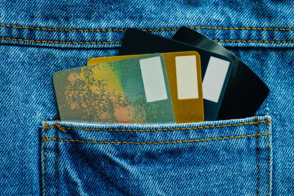 Credit cards in back of pocket blue denim jean for business and finance concept