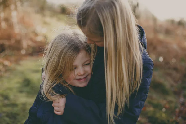 Two cute blond sisters — Stock Photo, Image