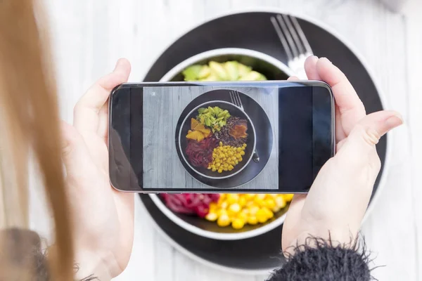 Hands taking photo of lunch bowl — Stock Photo, Image