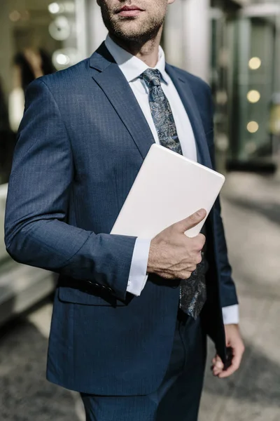 Businessman carrying digital tablet — Stock Photo, Image