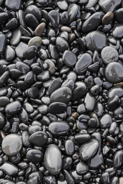 Hintergrund Von Schwarzen Nassen Steinen Strand — Stockfoto
