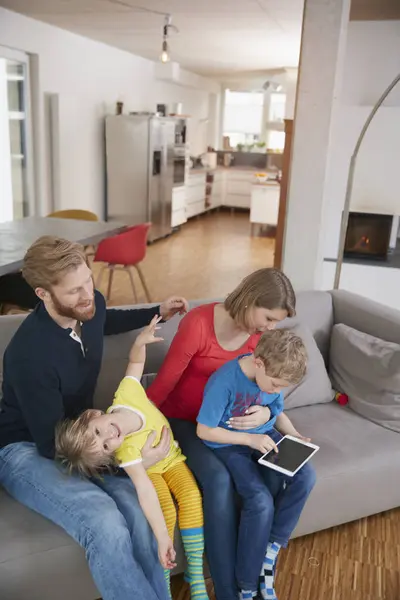 Family Four Digital Tablet Couch — Stock Photo, Image