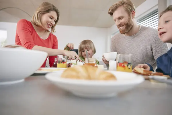 Happy Family Four Having Breakfast — Stock Photo, Image