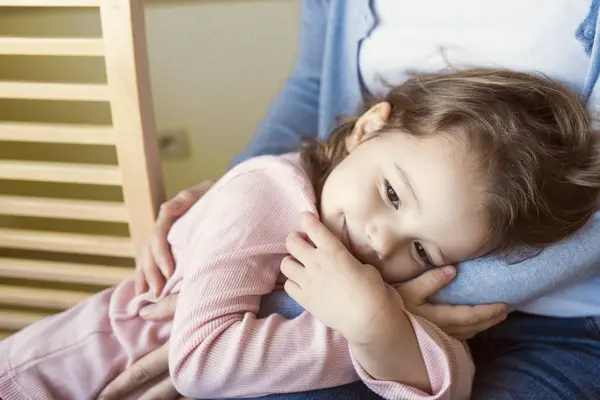 Girl cuddling with mother — Stock Photo, Image