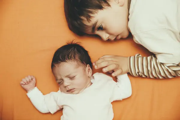 Newborn Baby Girl Brother Lying Bed — Stock Photo, Image