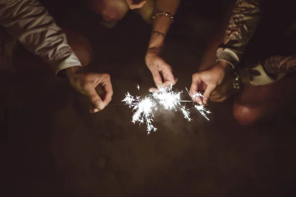 Hands Three Friends Holding Sparklers Beach Night — Stock Photo, Image