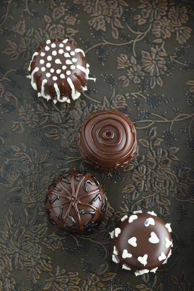 Four Ornate Chocolate Marshmallows Vintage Surface — Stock Photo, Image