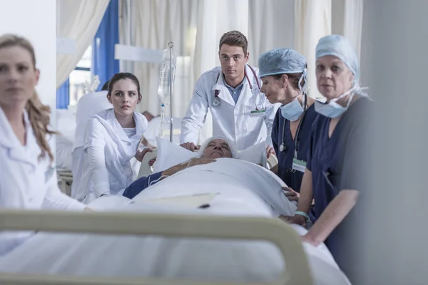 Hospital Staff Standing Bed Patient — Stock Photo, Image