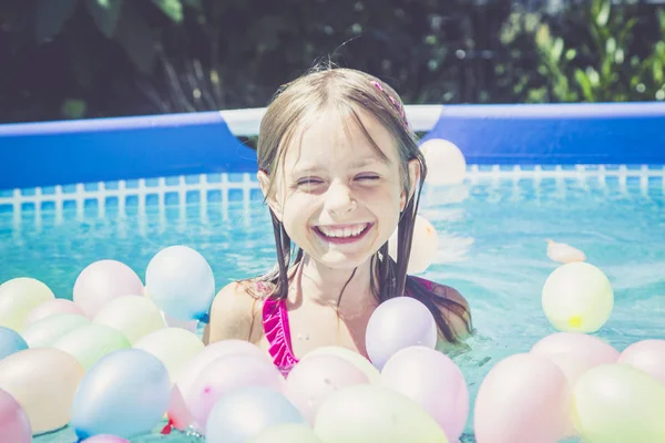 Happy Girl Swimming Pool Surrounded Balloons — Stock Photo, Image