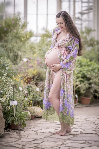 Portrait Pregnant Woman Wearing Fashionable Bathrobe Standing Greenhouse — Zdjęcie stockowe