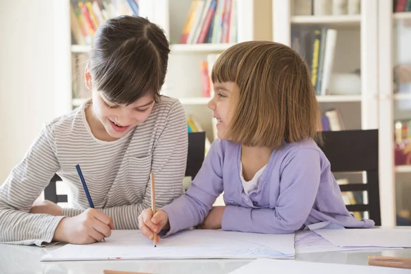 Two Smiling Sisters Drawing Desk — Stock Photo, Image