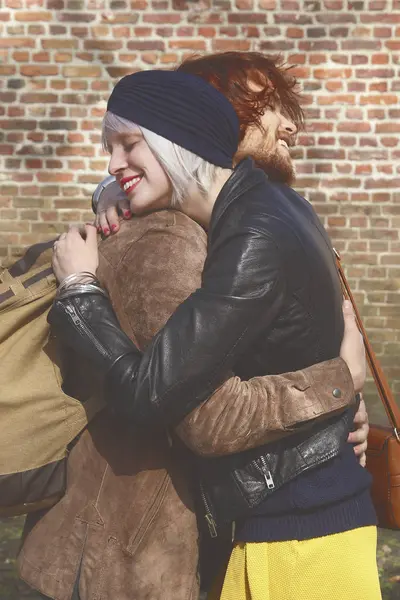 Young Couple Embracing Outdoors Brick Wall — Stock Photo, Image