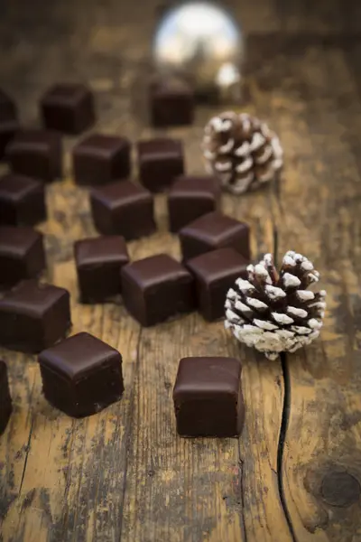 Closeup Chocolate Dominos Fir Cones Wood — Stock Photo, Image