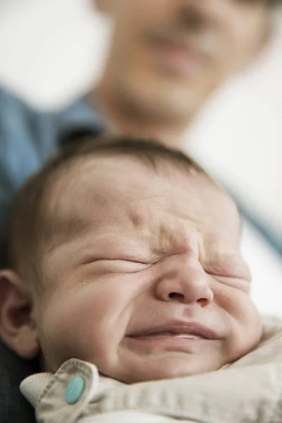 Young Father Holding His Crying Newborn Son — Stock Photo, Image
