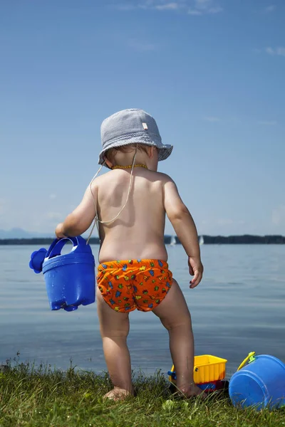 Baby Boy Watering Can Front Lake — Stock Photo, Image