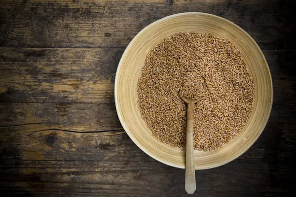 Spelt Seeds Wooden Bowl Spoon Dark Wood — Stock Photo, Image