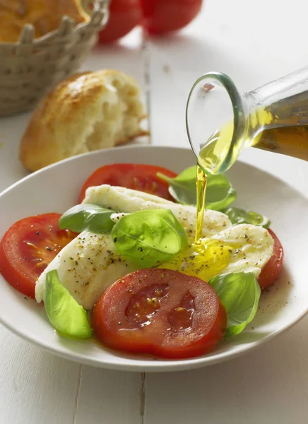 Caprese salad in plate — Stock Photo, Image