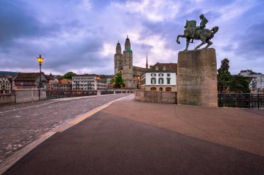 Grossmunster Church and Mayor Hans Waldmann Statue in the Mornin clipart