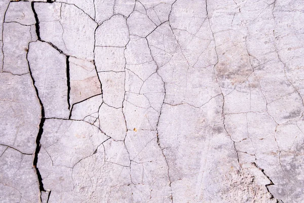 Cracked concrete texture. Faults and cracks on the stone surface. — Stock Photo, Image