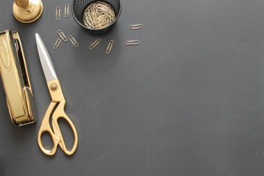 Gold Styled Desk Accessories on Black Background