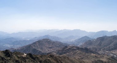 Al Hada Mountain in Taif City, Saudi Arabia with Beautiful View of Mountains and Al Hada road inbetween the mountains. clipart