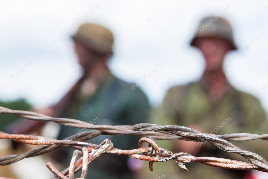 Barbed wire soldiers