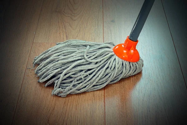 Detail of wooden floor cleaning with mop — Stock Photo, Image