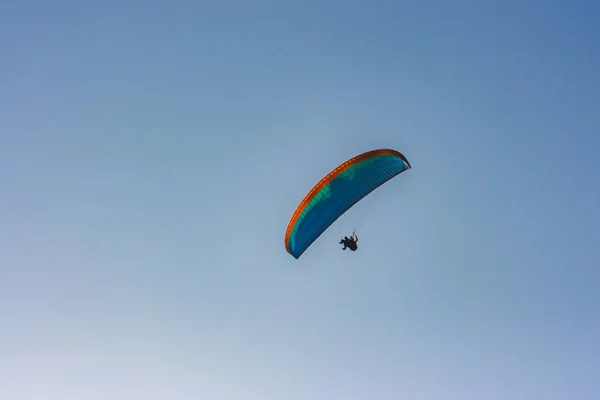 Blue and orange paraglider over Lima, Peru — Stock Photo, Image