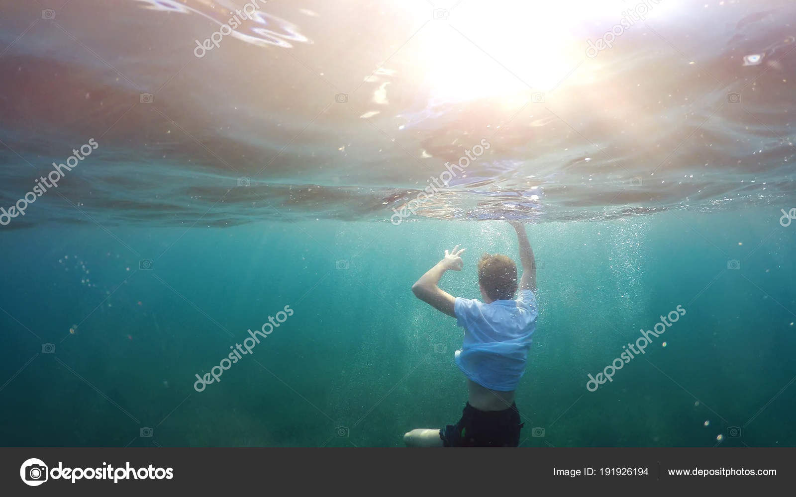 Young Man Sinking Sea Stock Photo by ©mike_kiev 191926194