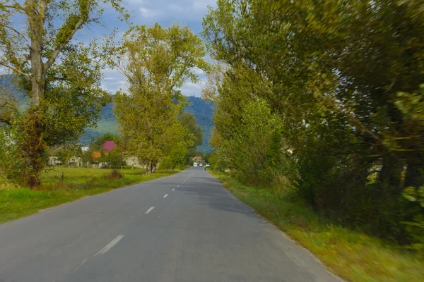 Mountain road. The landscape of fields and mountains — Stock Photo, Image