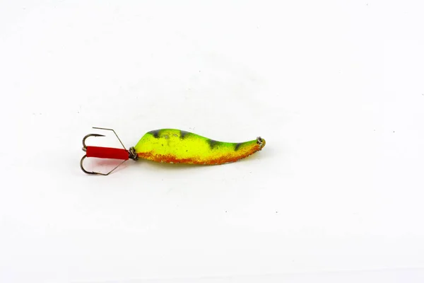 Exhibition of pirated copies of fishing metal spoon baits. Bait for fishing in the shape of a spoon with a hook on a white background — Stock Photo, Image