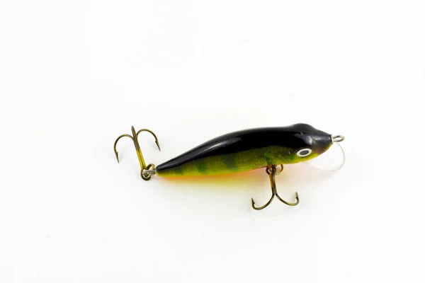 Fishing tackle - fishing spinning, hooks and lures on light wooden