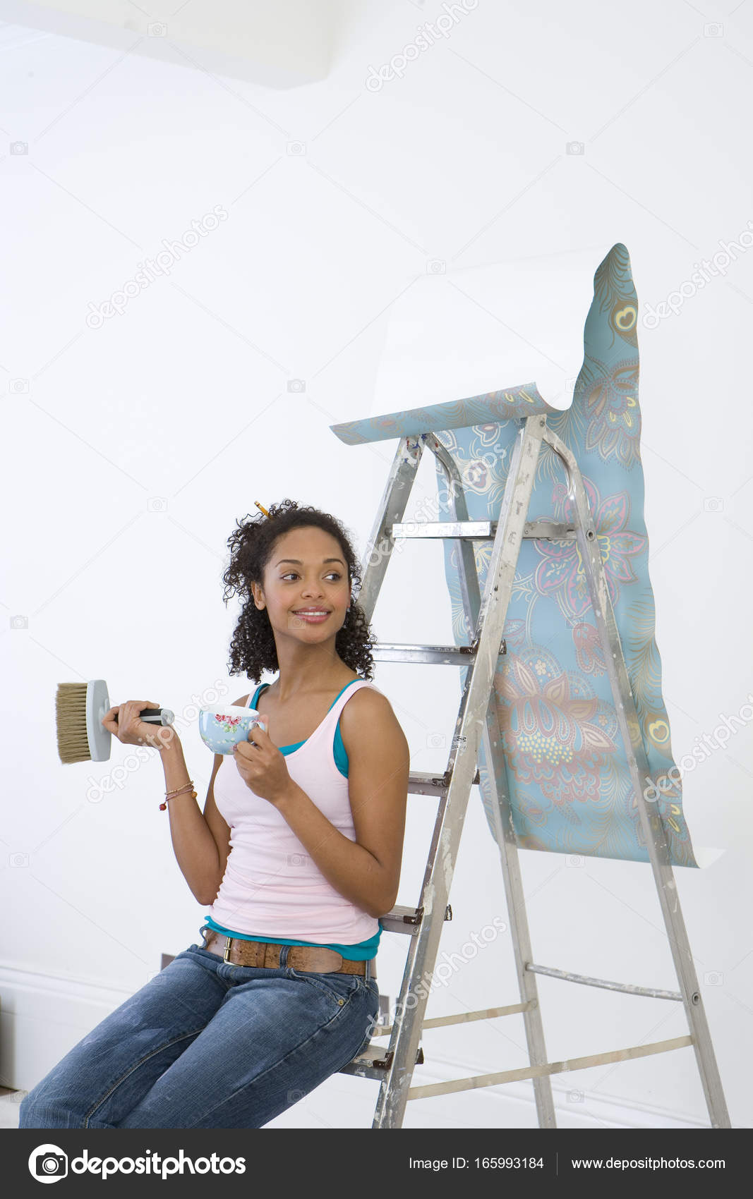 Young Woman Ladder Mug Taking Break Hanging Wallpaper Smiling Stock Photo Young Woman Ladder Mug Taking Break Hanging Wallpaper Smiling Stock Photo