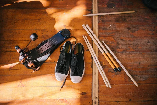 Sneakers with pedal and drumsticks — Stock Photo, Image