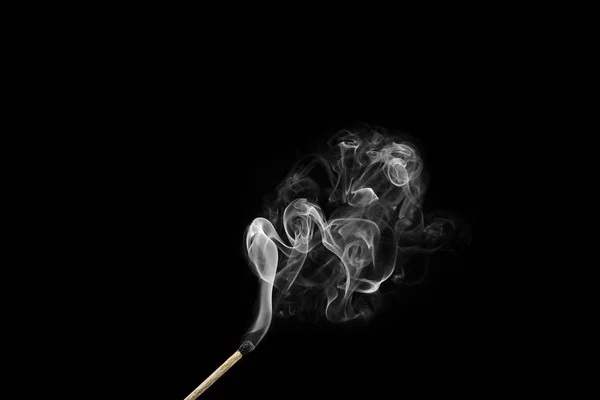 Burnt match with curls of smoke isolated on black — Stock Photo, Image