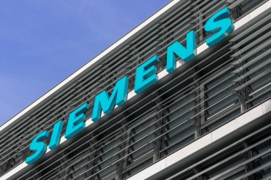 Company logo of Siemens AG on the exterior of their Munich headquarters clipart