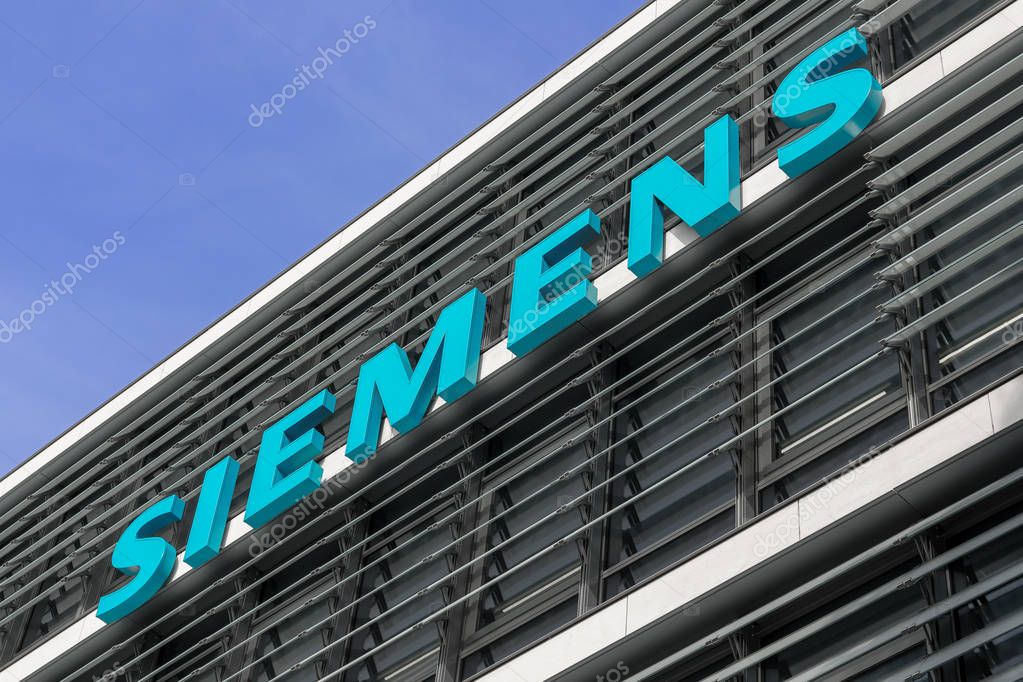 Munich, Germany - June 6, 2017: Company logo on the exterior of the headquarters of Siemens AG
