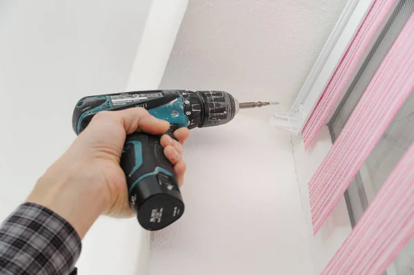 Installing fabric roller blinds. — Stock Photo, Image